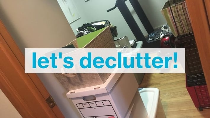 Boxes with a banner saying "let's declutter!"