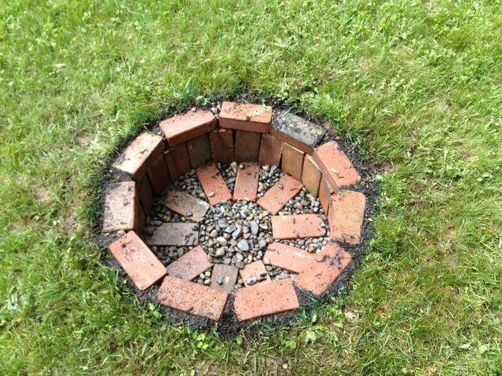 Sunk brick fire pit.