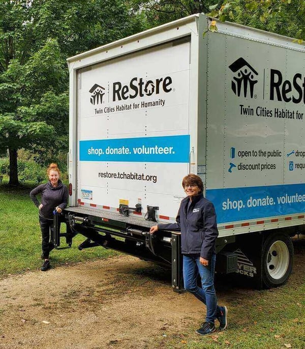 Robin and a member of the donations team with the ReStore donations truck.