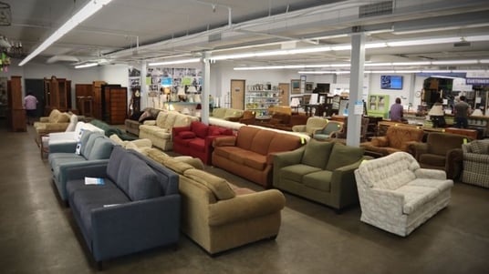 ReStore showroom with couches and other furniture.
