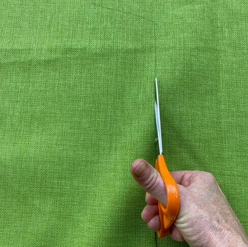 Cutting the new fabric.