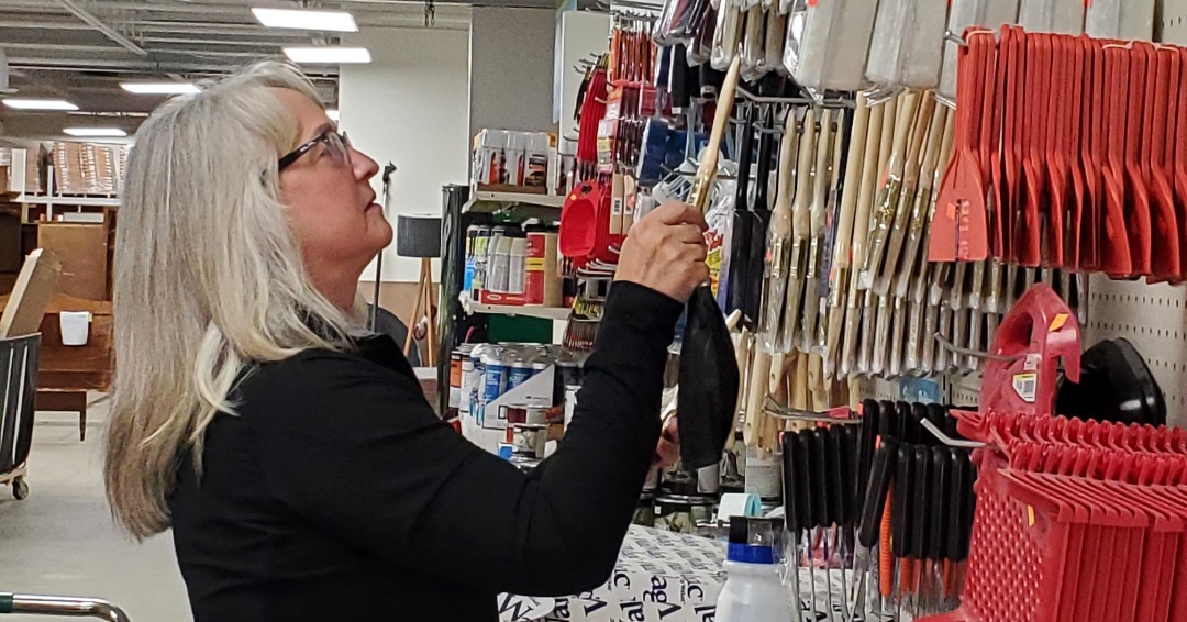 Woman volunteering at twin cities habitat for humanity restore