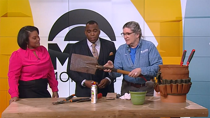 Jan holding a shovel at the WCCO studio.