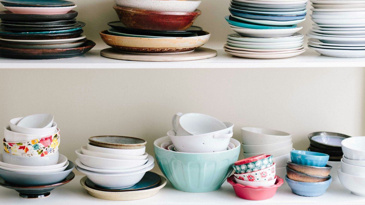 Bowls and plates on a shelf.