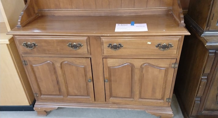 An oak colored buffet 