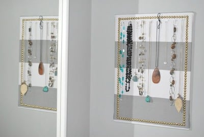 Bulletin board with fabric over it turned into a jewelry holder.