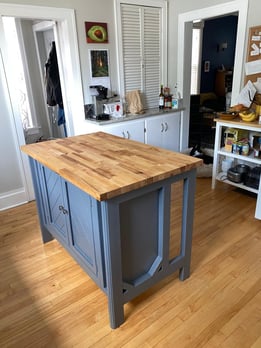 Blue cabinet with butcher block top - kitchen island