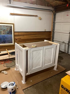 Brown cabinet being painted