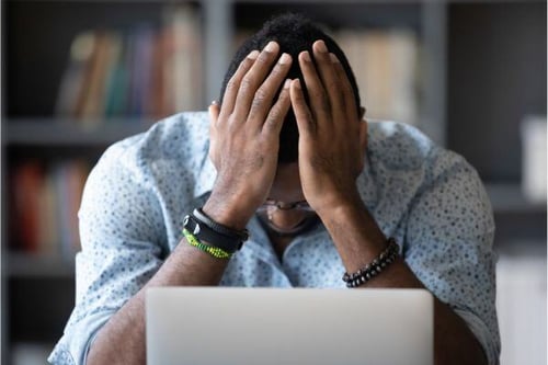 Frustrated person at computer