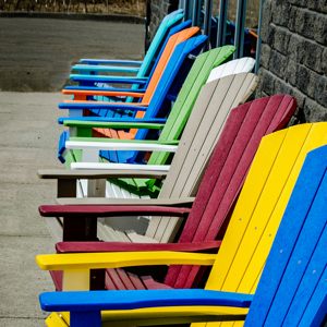 Colorful Adirondack chairs.