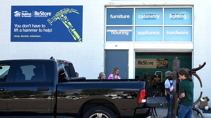 People dropping off a donation at ReStore in Minneapolis.