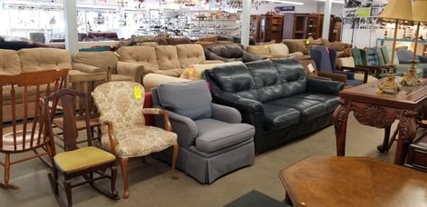 Assortment of couches and chairs on the showroom floor.