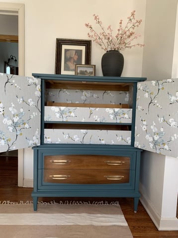 Painted dresser interior with flower patterned paper