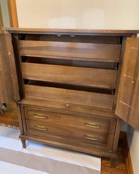 Large brown dresser interior with shelves