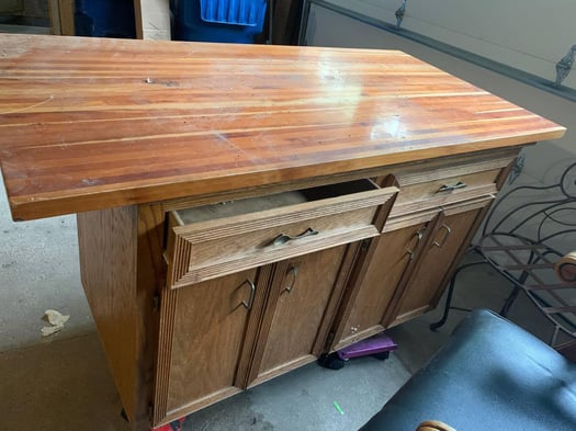 Upcycled yellow cabinet with utensils for handles