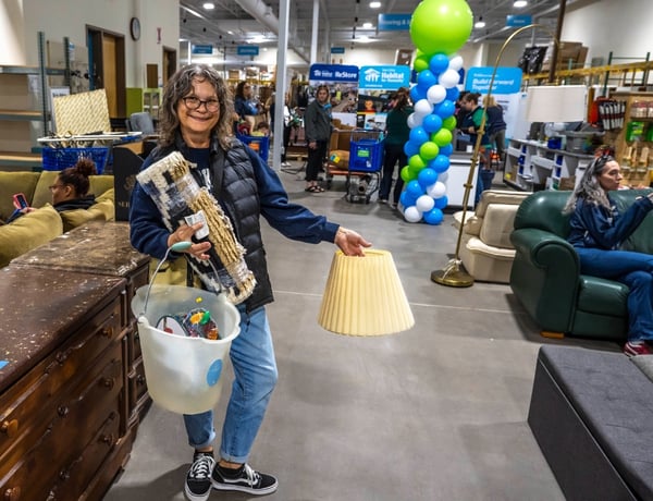 ReStore shopper carrying several items.