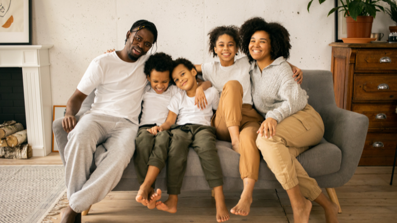 Family sitting on a couch.