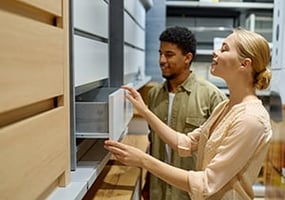 a couple choosing new kitchen cabinets