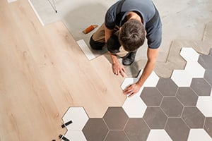 a man installing new flooring