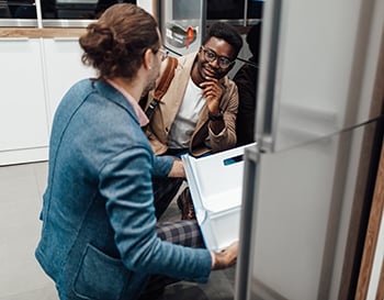 two men shopping for appliances