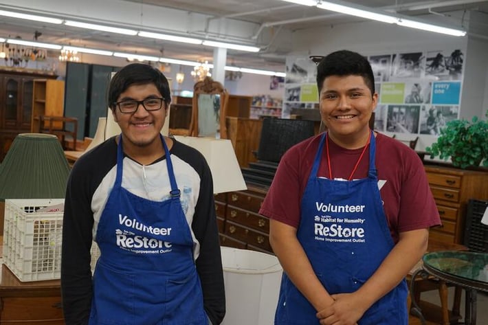 Ruben and Emanuel volunteering at the ReStore.