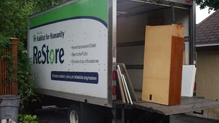 ReStore truck being loaded with donations.