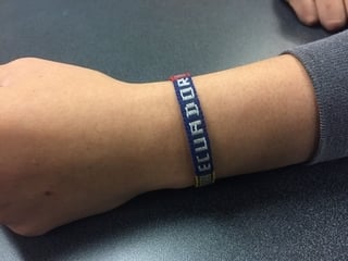 A bracelet that says Ecuador.