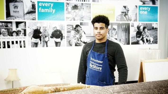 Andrese in a volunteer apron.
