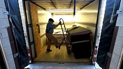 Unloading cabinets from a truck
