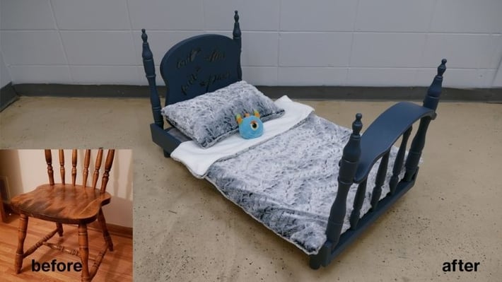 A wood chair transformed into a dark blue bedframe.