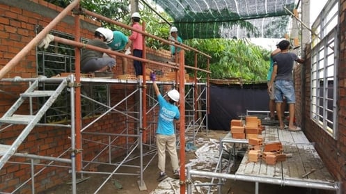 Paul and volunteers at a Global Village build.