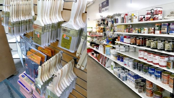 Paint brushes and cans of paint at ReStore.