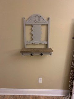 The finished shelf hanging on the wall.