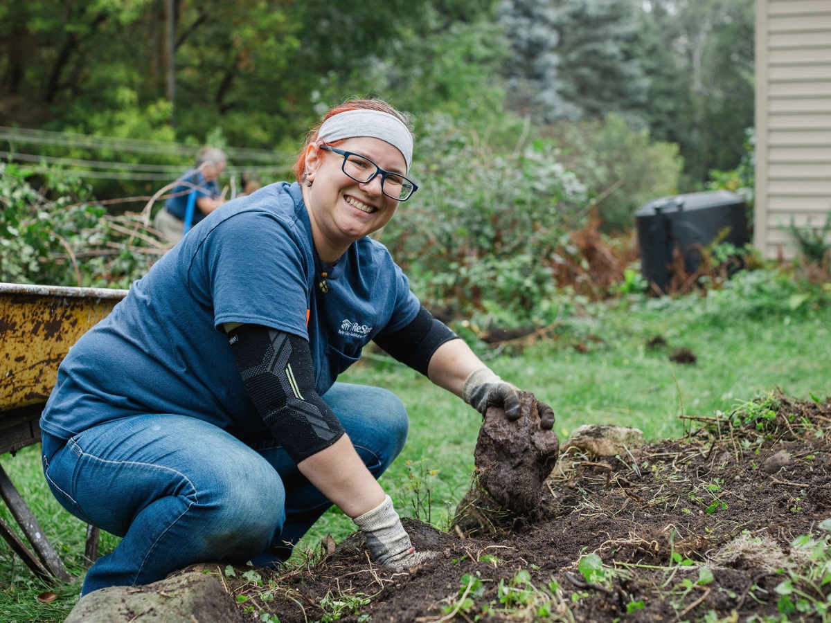 ReStore employee working in the garden.