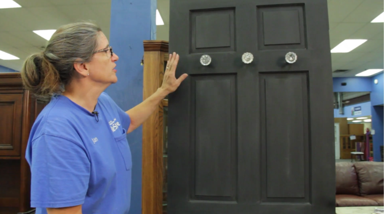 Jan showing off mudroom cabinets.