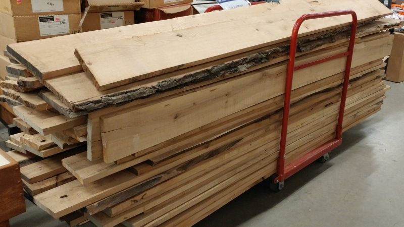 Rough-sawn planks on a trolley.